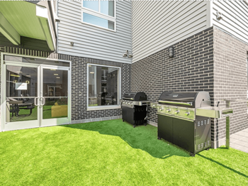 Outdoor patio with barbecues and fire pit